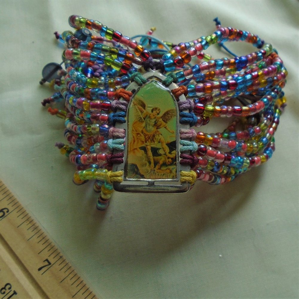 Archangel stabbing someone bracelet